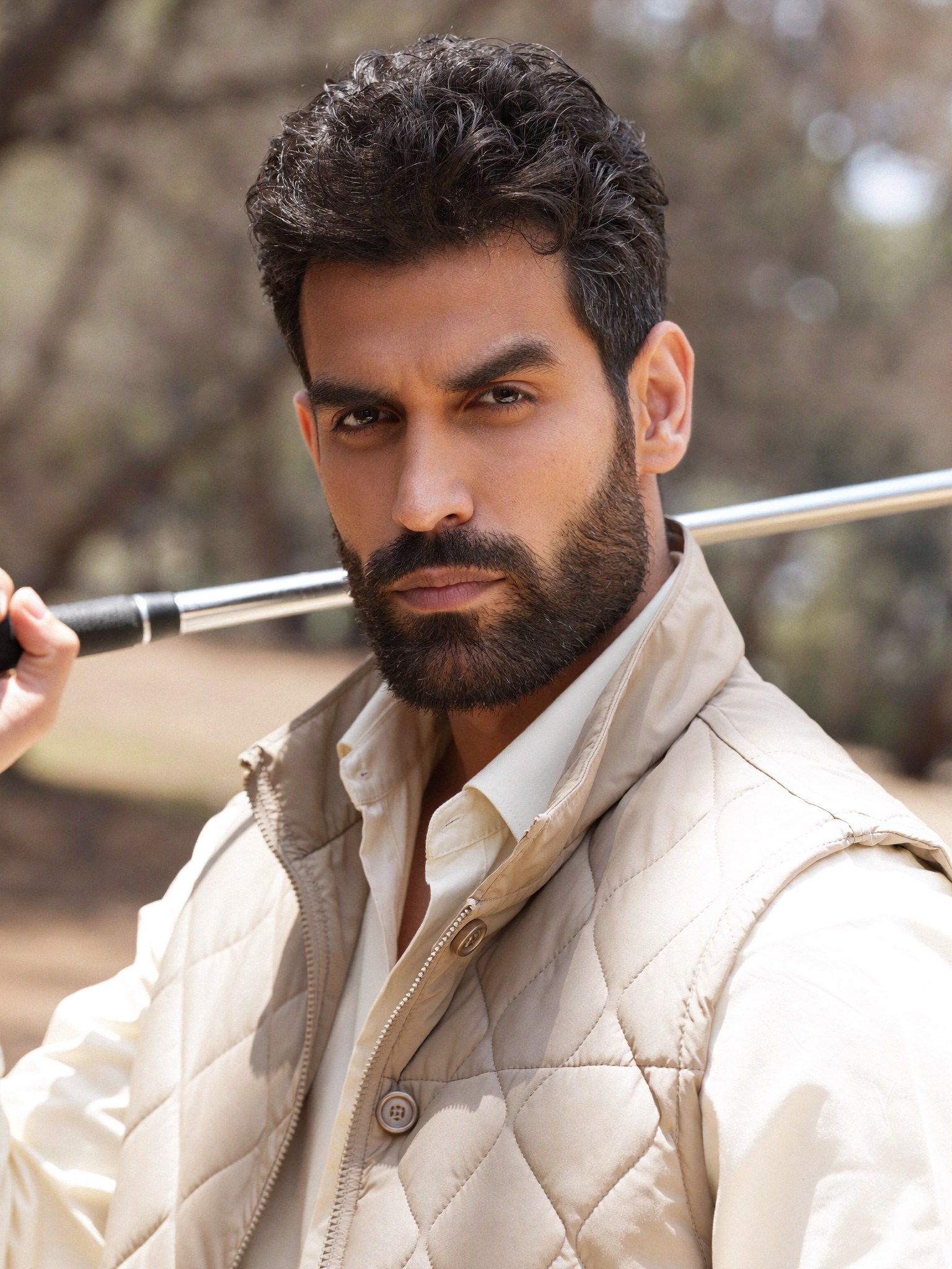 Saman Parham in a cream outdoor portrait